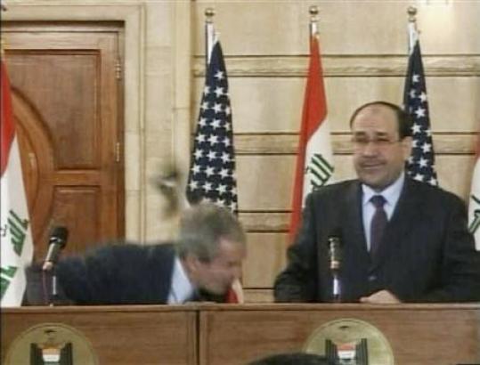 A video grab of President Bush ducking from a shoe during a news conference in Baghdad, December 14, 2008. (REUTERS/Reuters TV
